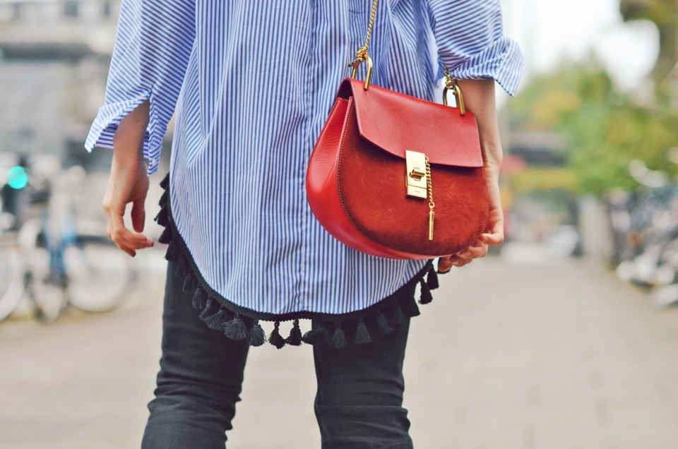 chloé handbag, red leather, long blouse, blue stripes, black jeans