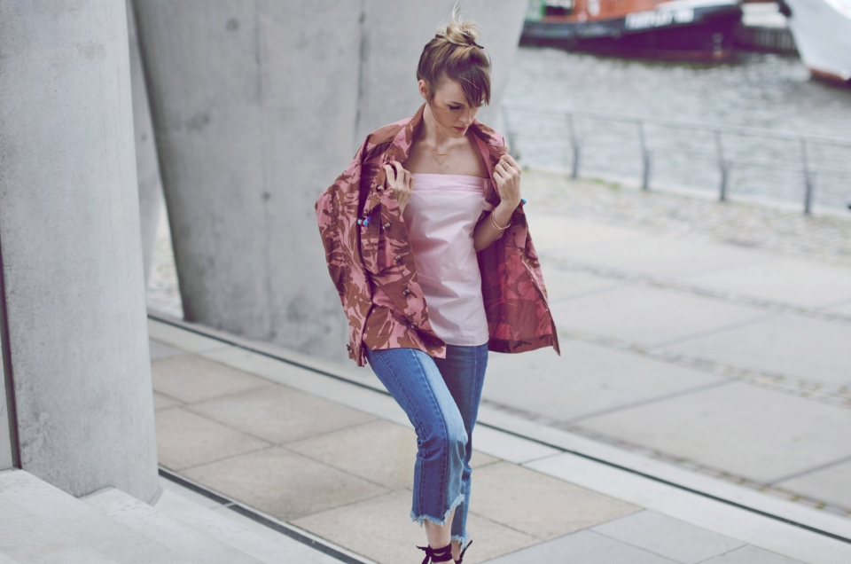 high bun hair, pink jacket, top, two color jeans