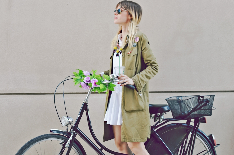 bicycle, olive parka, patches, white shirt dress