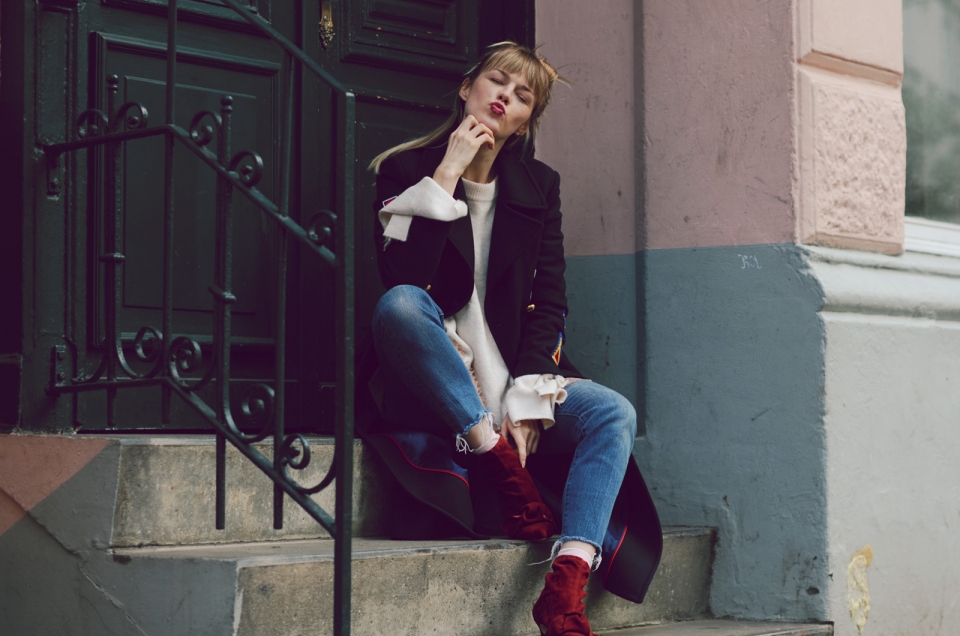 red leather boots, long coat, jeans, white pullover