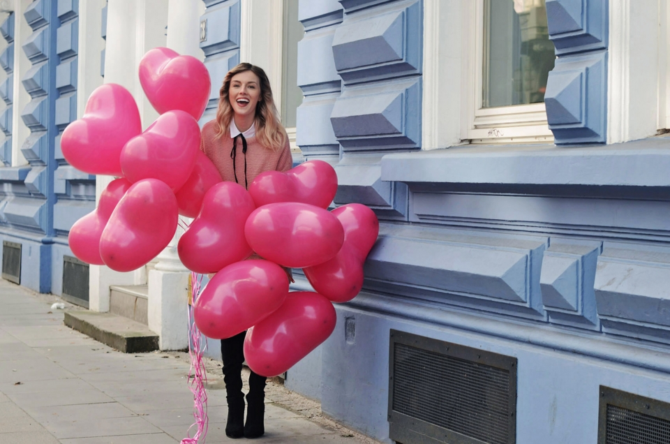 valentines balloons, pink-colored sweater, long blouse